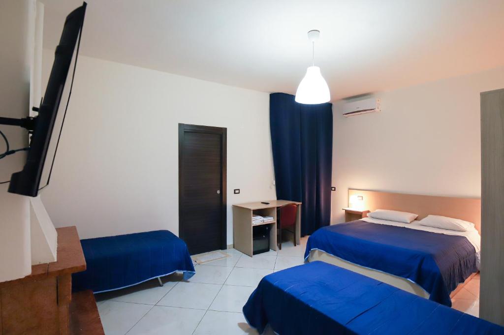 Postel nebo postele na pokoji v ubytování max hotel e restaurant