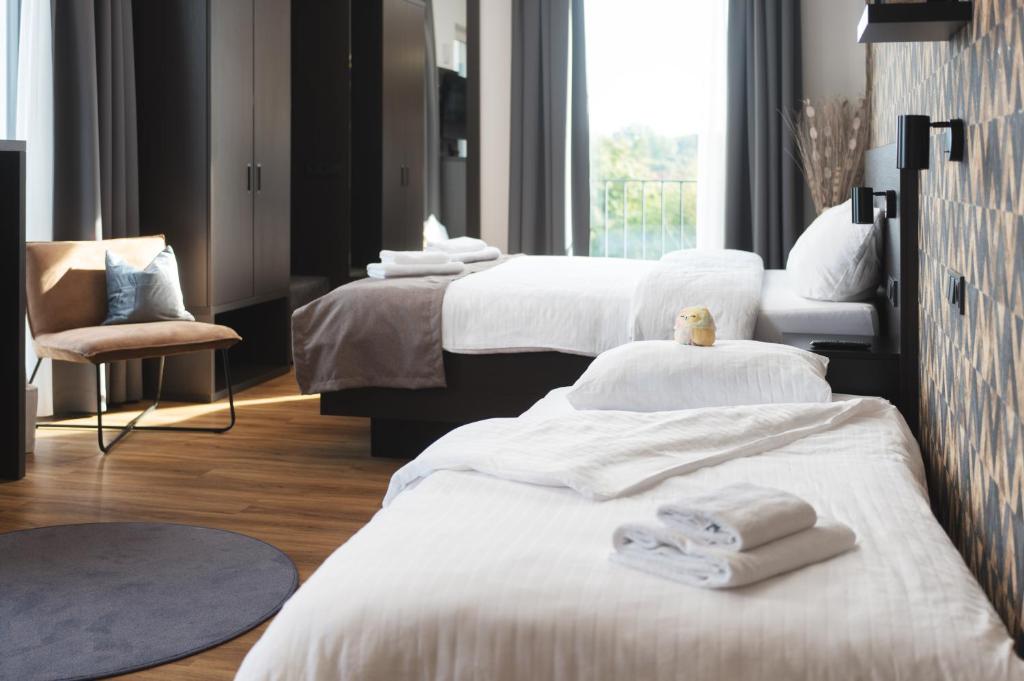 Postel nebo postele na pokoji v ubytování We rooms Hotel