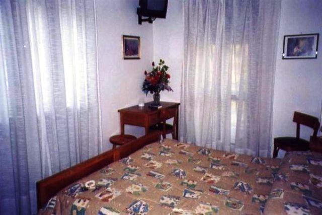 Postel nebo postele na pokoji v ubytování Hotel Savoia Debili