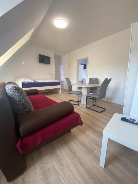 a living room with a couch and a table at Annie´s Appartements in Mannheim