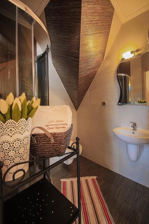 Kúpeľňa v ubytovaní Folk Resort Domki i Apartamenty