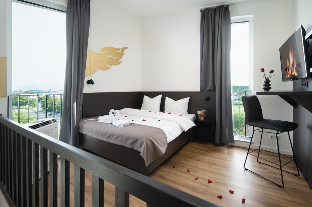 Postel nebo postele na pokoji v ubytování We rooms Hotel