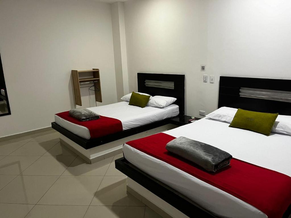 Postel nebo postele na pokoji v ubytování Hotel Laureles Park