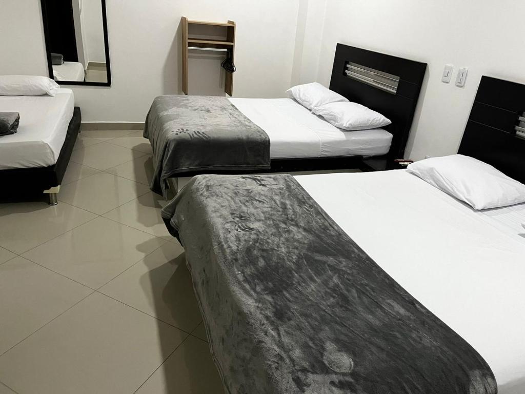 Postel nebo postele na pokoji v ubytování Hotel Laureles Park