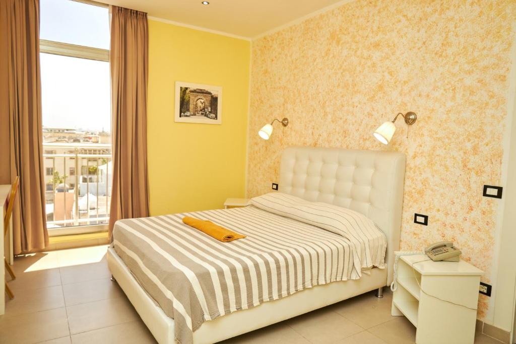 Postel nebo postele na pokoji v ubytování LA VlTA E' BELLA