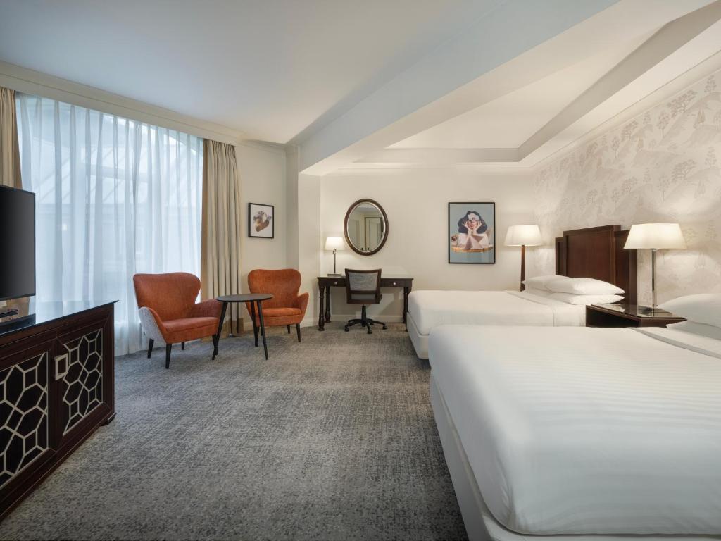 Ein Bett oder Betten in einem Zimmer der Unterkunft Delta Hotels by Marriott Worsley Park Country Club