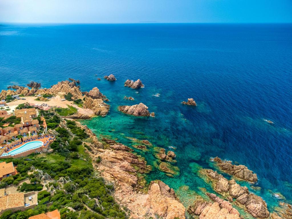an aerial view of the ocean and a resort at Villa Vittoria - Costa Paradiso in Costa Paradiso