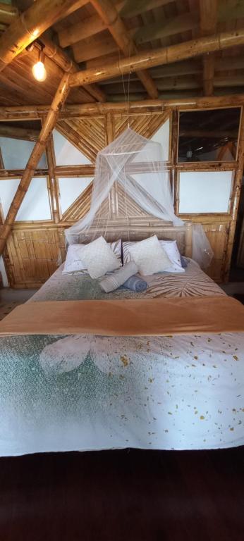Posteľ alebo postele v izbe v ubytovaní Ecohotel Soplo del Tambo