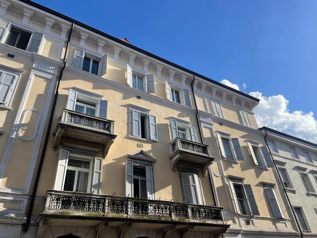 a large building with balconies on the side of it at Loving My Rooms 2 - delizioso appartamento in centro in Gorizia