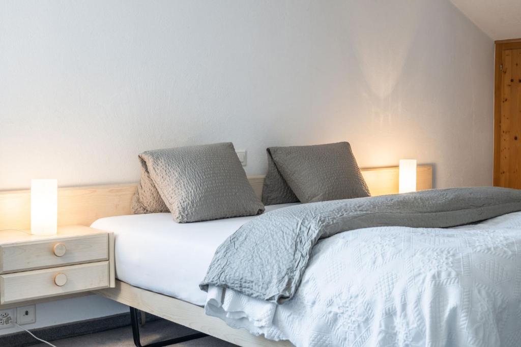 Postel nebo postele na pokoji v ubytování Hotel Alpina