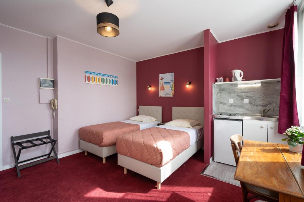 Postel nebo postele na pokoji v ubytování Hôtel Le Caddy