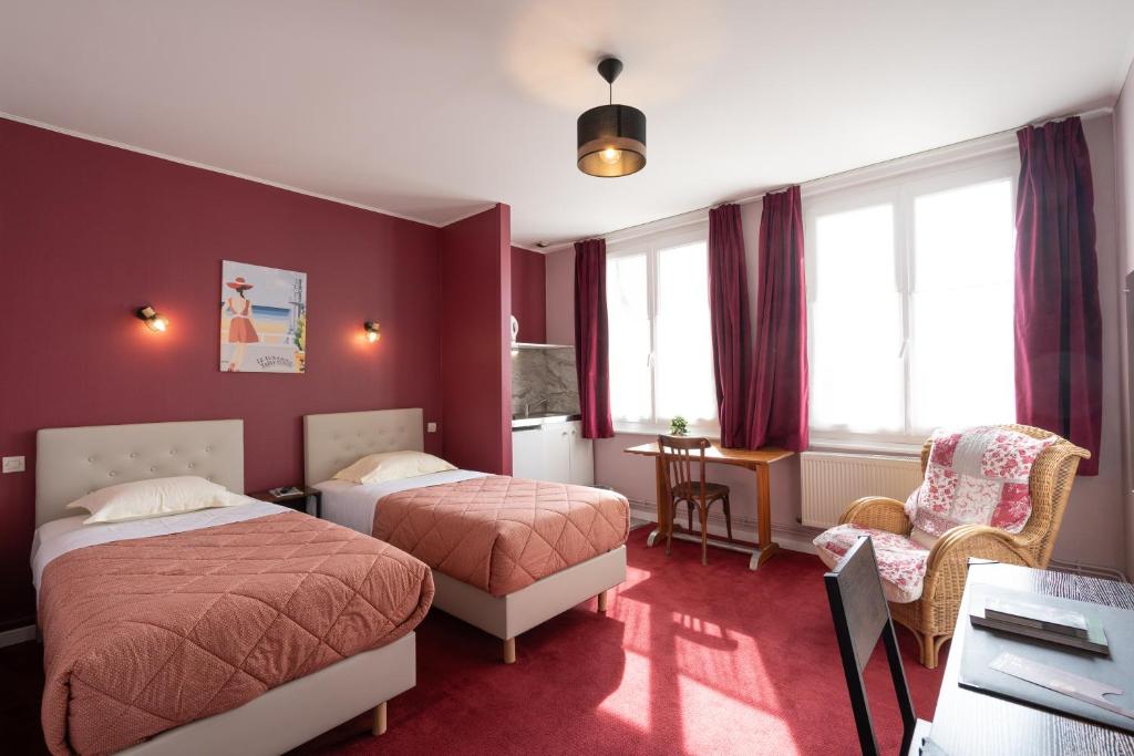 Postel nebo postele na pokoji v ubytování Hôtel Le Caddy