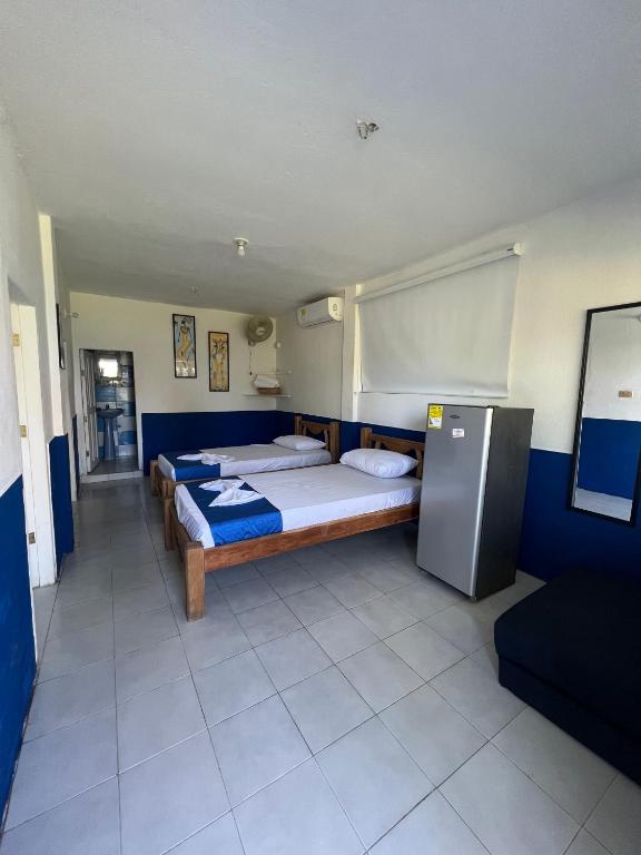 Postel nebo postele na pokoji v ubytování Tintipan Hotel