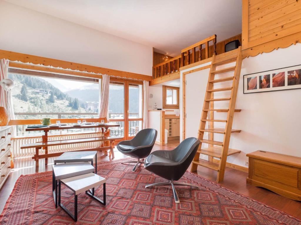 a room with chairs and a desk and a ladder at Studio Courchevel 1650, 1 pièce, 5 personnes - FR-1-563-31 in Courchevel