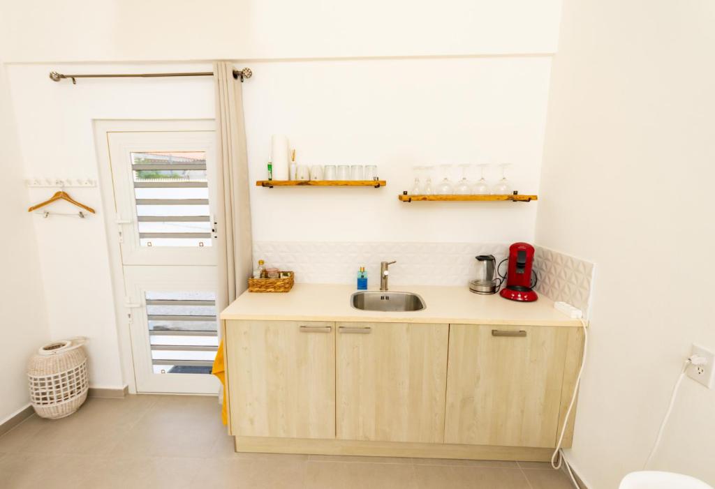 Kuchyň nebo kuchyňský kout v ubytování Studio Apartment Volterra Curacao