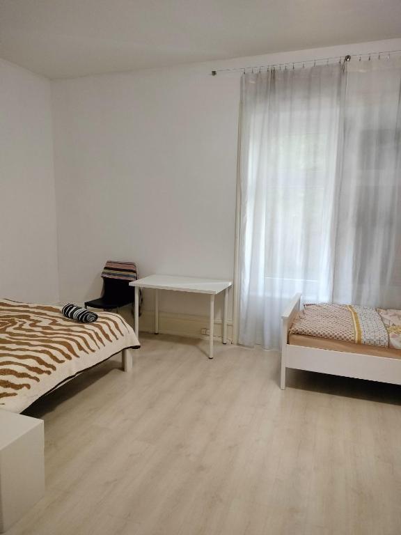 Postel nebo postele na pokoji v ubytování City Home Zurich
