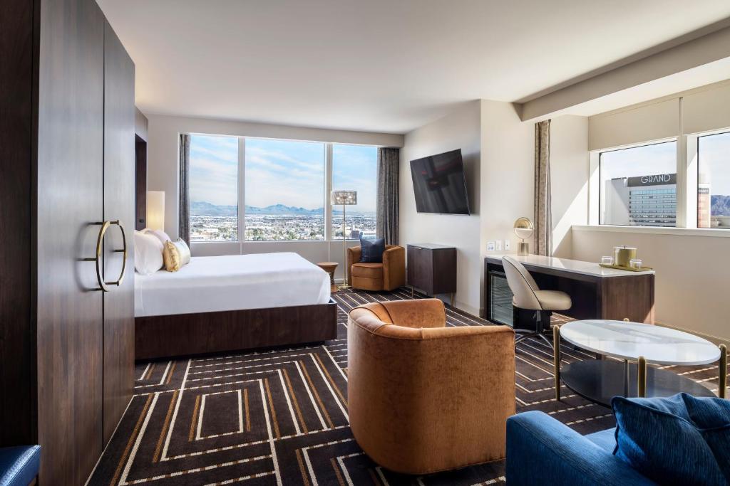 a hotel room with a bed and a desk at Circa Resort & Casino - Adults Only in Las Vegas