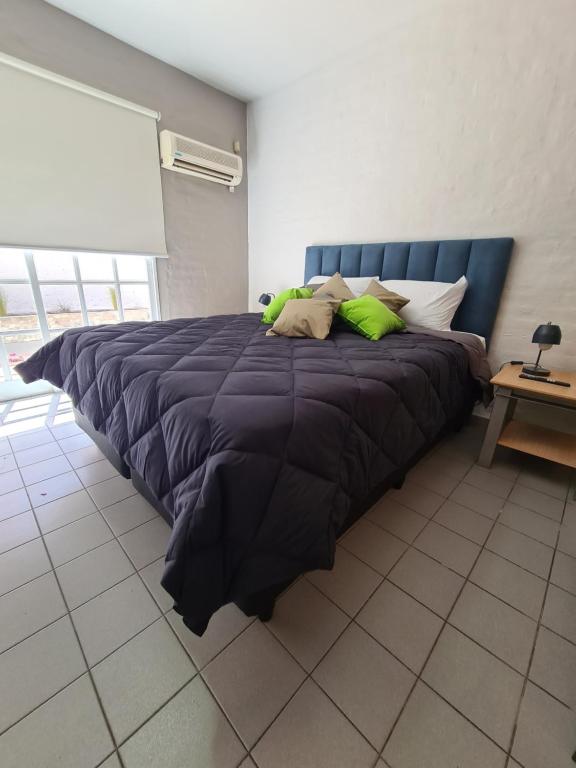 Llit o llits en una habitació de Avellaneda Apart 3