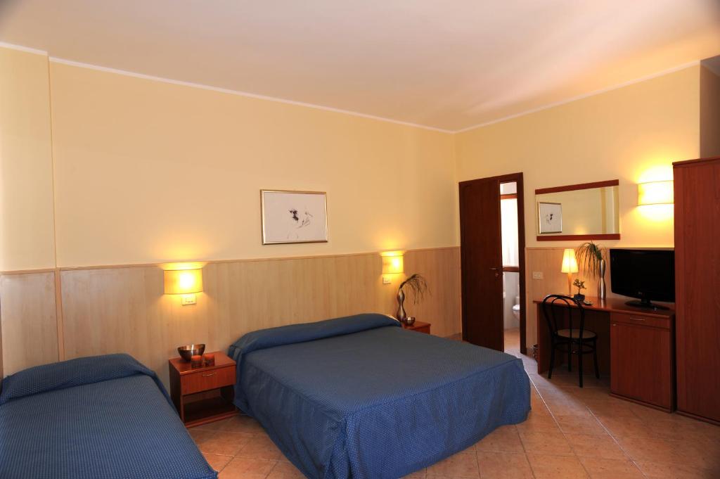 Postel nebo postele na pokoji v ubytování Villa Santacroce