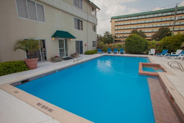 a large swimming pool in front of a building at Fiddler on the Reef at Playa Rana in Virginia Beach