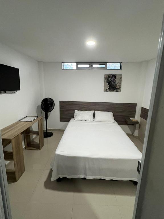 Postel nebo postele na pokoji v ubytování EDIFICIO Niza80 IBAGUE, ACCESO DIGITAL CERCA PARQUE DEPORTIVO
