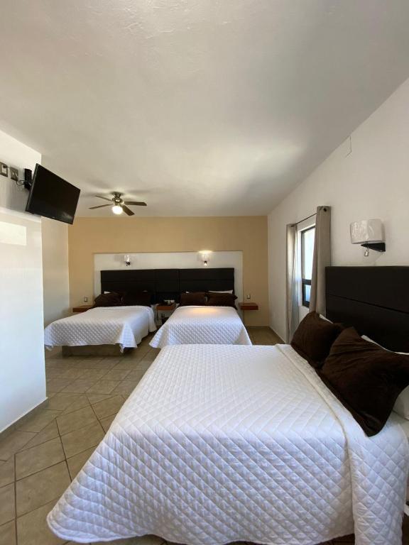 Postel nebo postele na pokoji v ubytování Hotel El Relicario