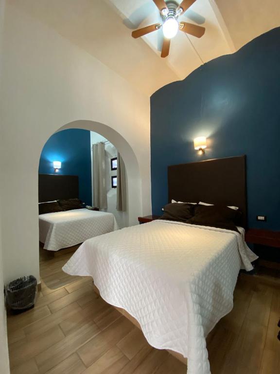 Postel nebo postele na pokoji v ubytování Hotel El Relicario