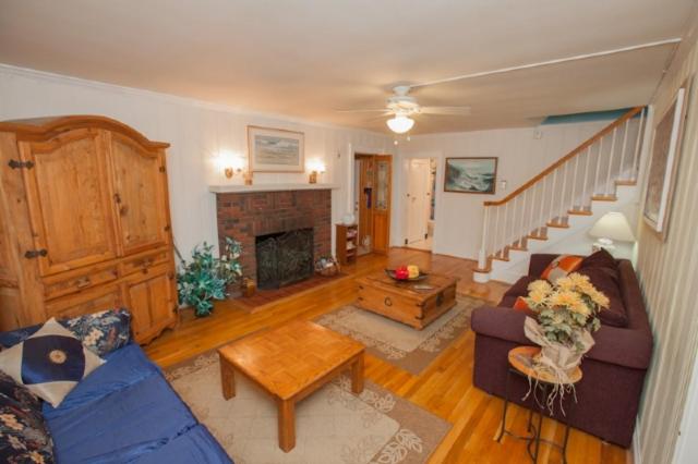 a living room with a couch and a fireplace at Loraine's Retreat in Virginia Beach