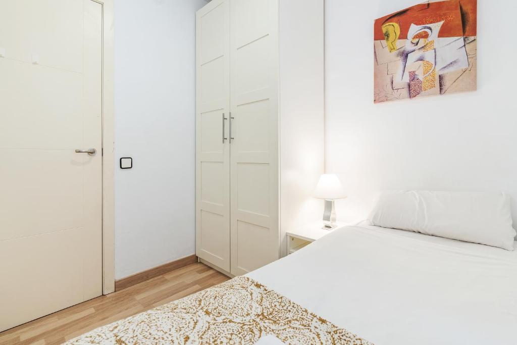 Postel nebo postele na pokoji v ubytování Sagrada Familia Avenida Gaudi Views&cozy Lounge