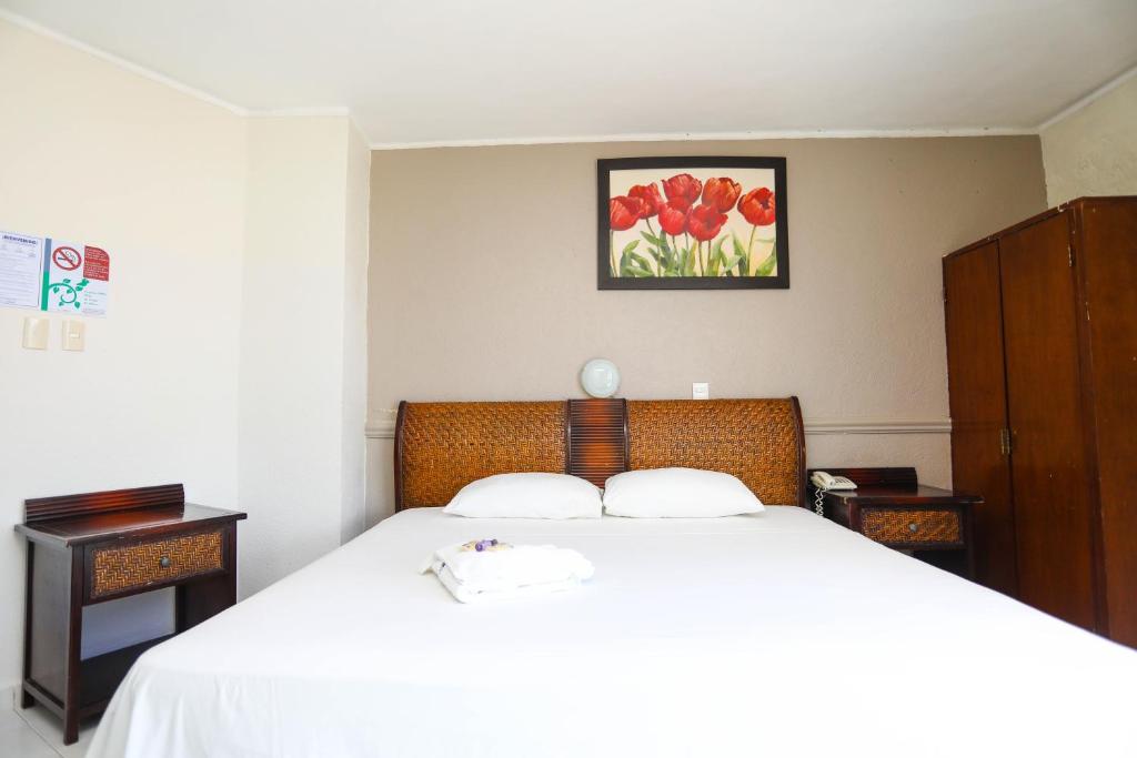 Postel nebo postele na pokoji v ubytování Hotel Parador