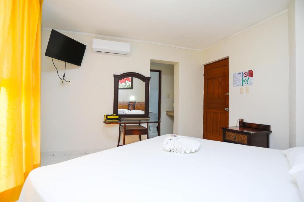 Postel nebo postele na pokoji v ubytování Hotel Parador