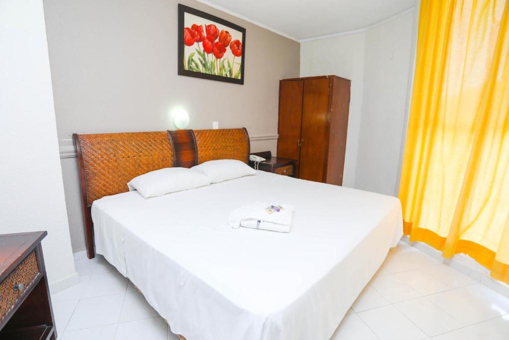 Postel nebo postele na pokoji v ubytování Hotel Parador