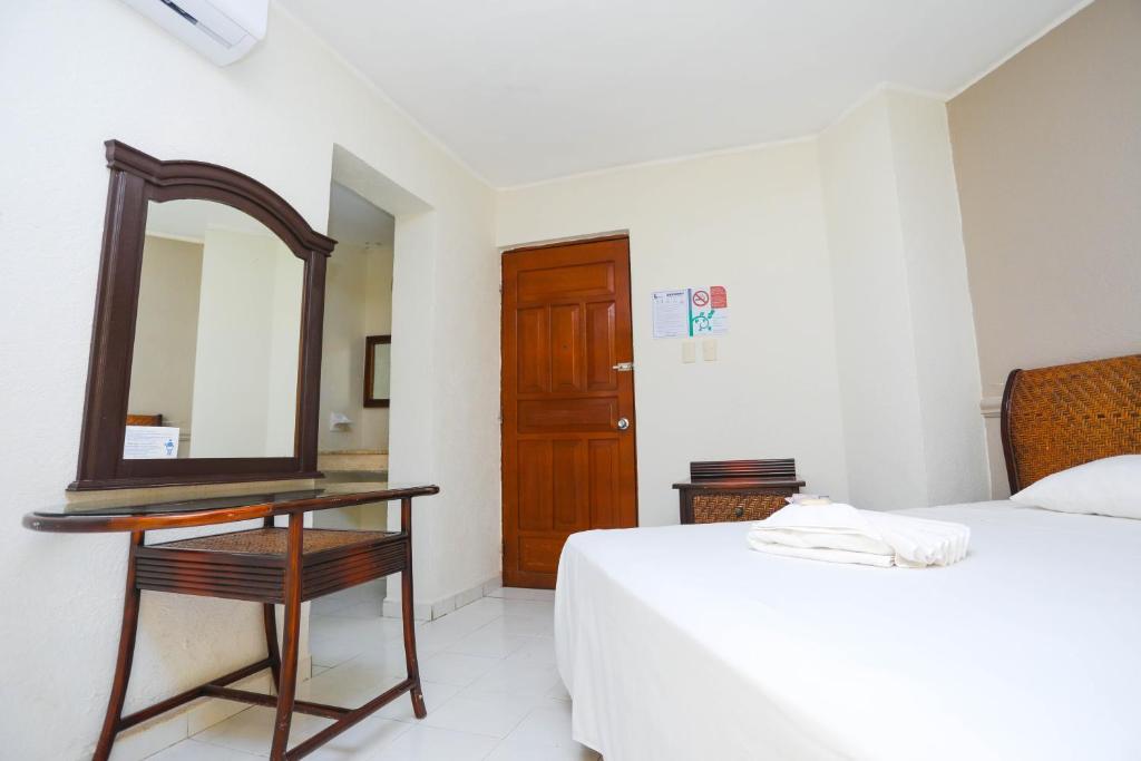 Postel nebo postele na pokoji v ubytování Hotel Parador