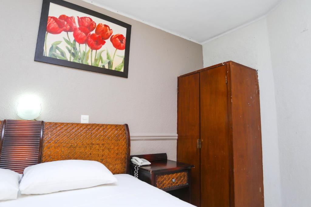 Postel nebo postele na pokoji v ubytování Hotel Parador