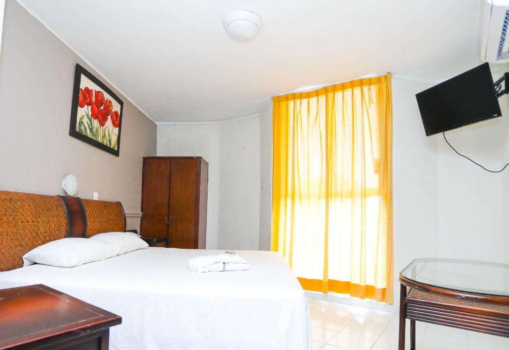 Postel nebo postele na pokoji v ubytování Hotel Parador