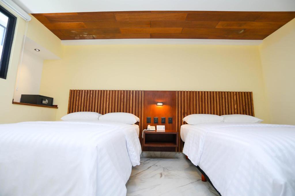 Postel nebo postele na pokoji v ubytování Hotel Parador