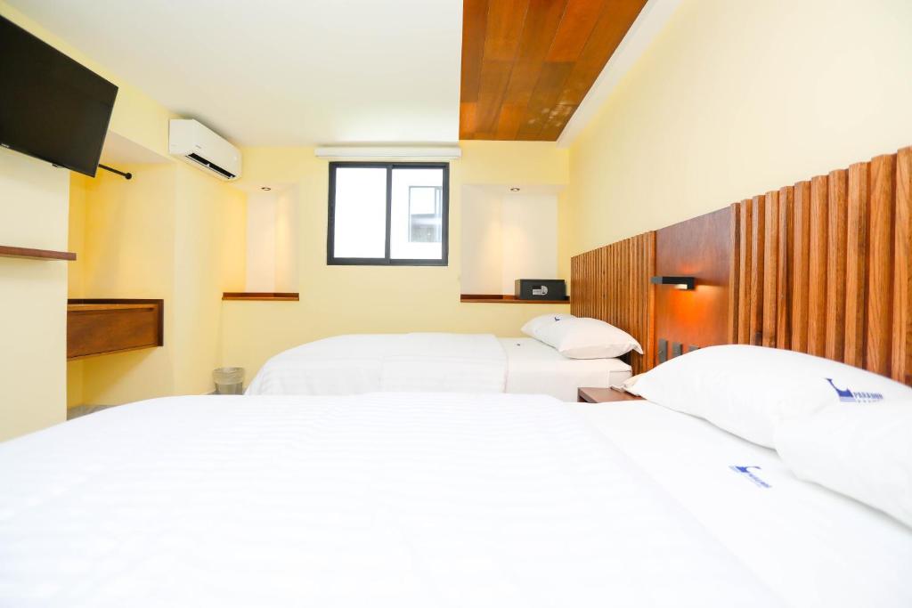 Postel nebo postele na pokoji v ubytování Hotel Parador