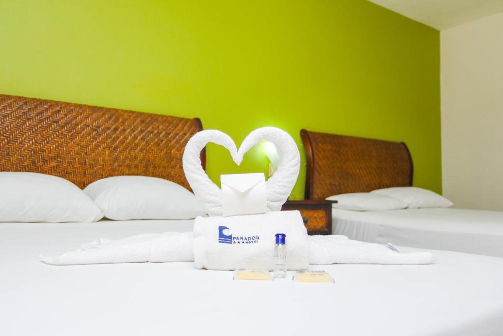 Postel nebo postele na pokoji v ubytování Hotel Parador