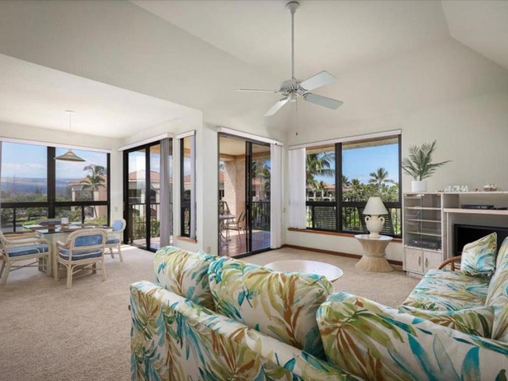 a living room with a couch and a table at Shores at Waikoloa 301 - MCH in Waikoloa