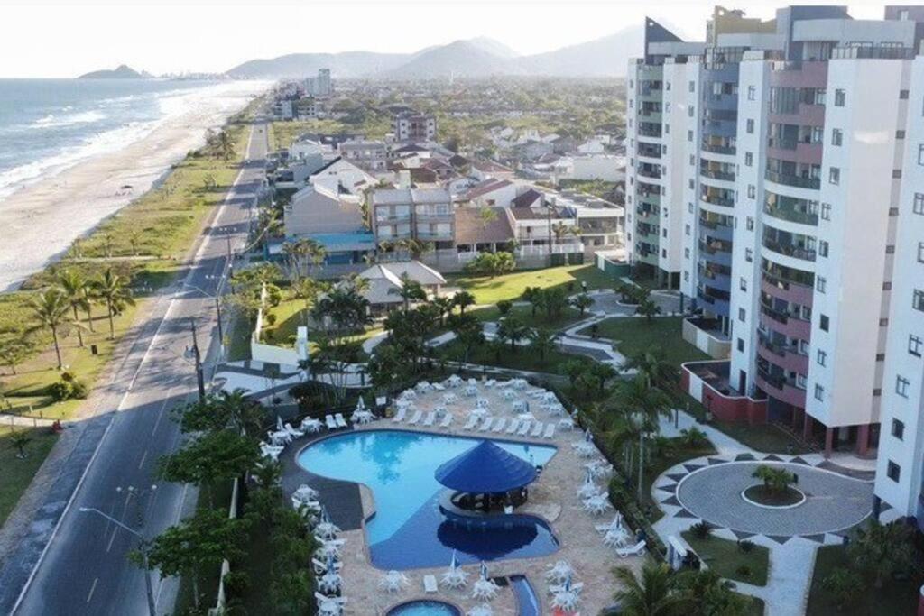 an aerial view of a resort and the beach at Uma Ilha no Ilhas do Caribe Resort in Matinhos