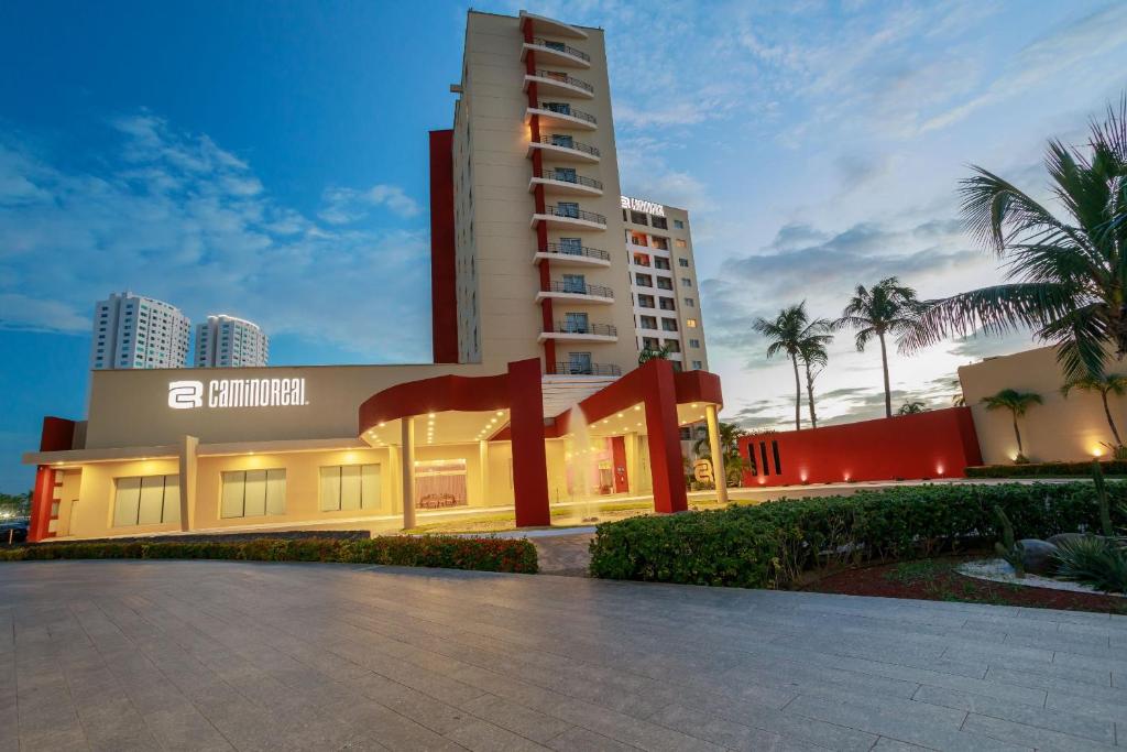 a hotel in front of a tall building at Camino Real Veracruz in Veracruz