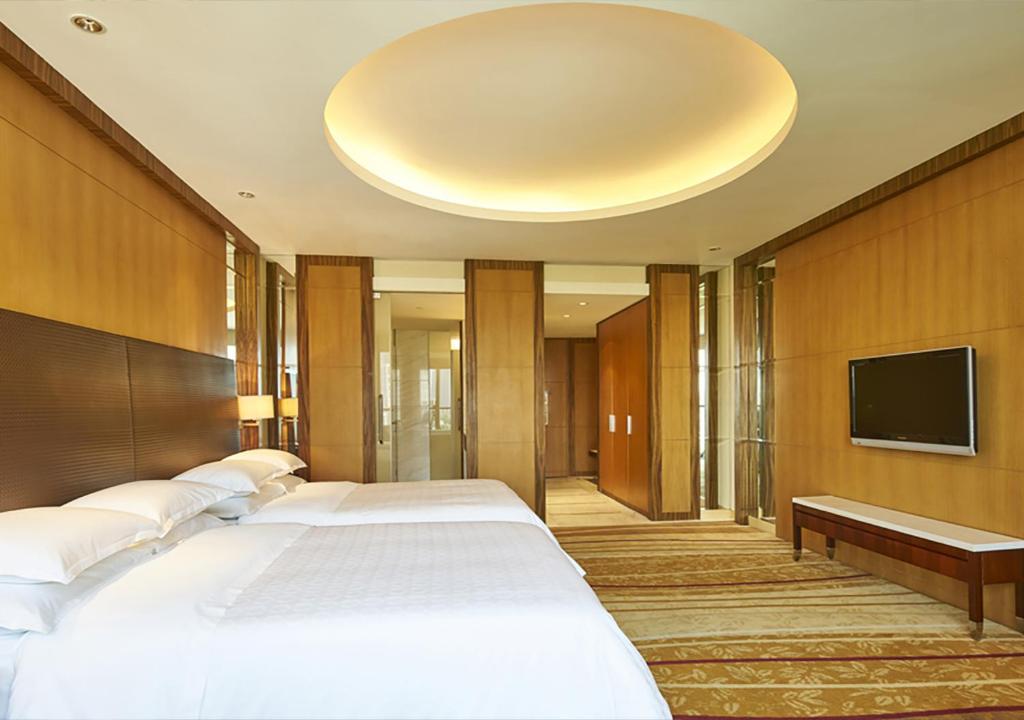 Postel nebo postele na pokoji v ubytování Sheraton Zhoushan Hotel