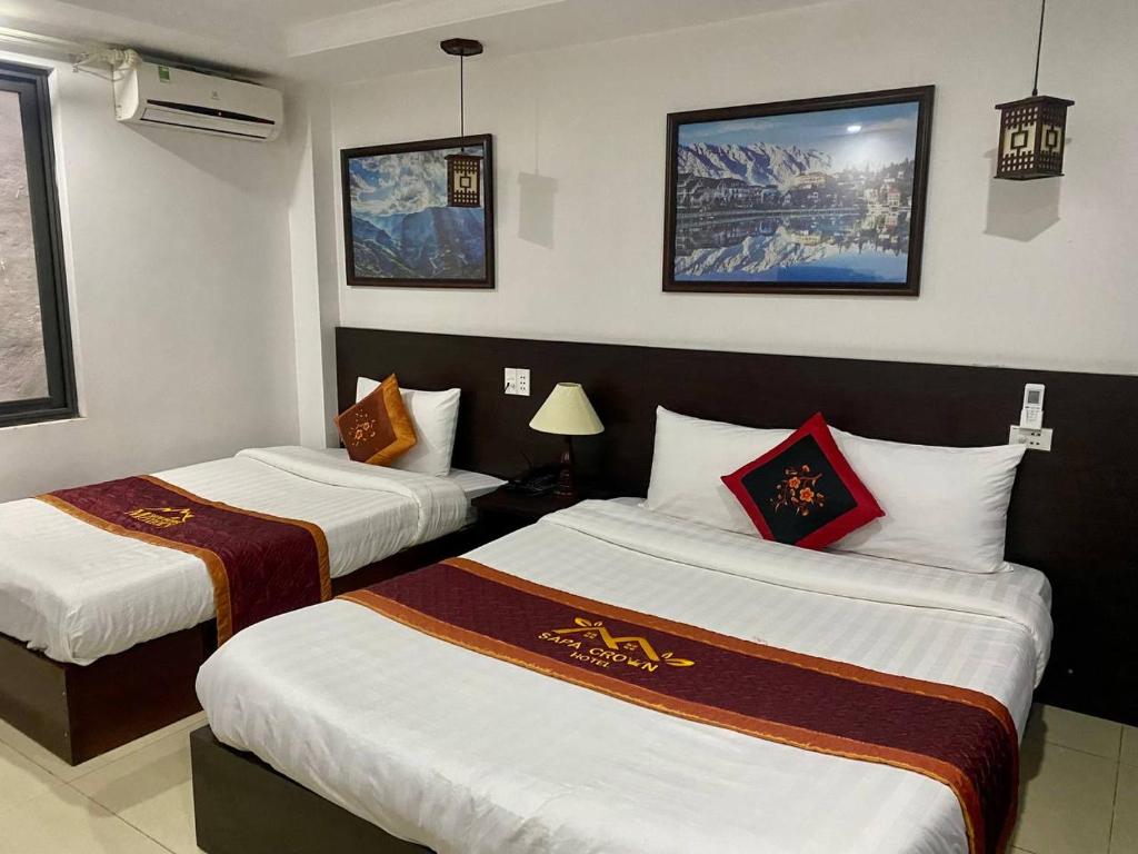 Säng eller sängar i ett rum på Sapa Crown Hotel