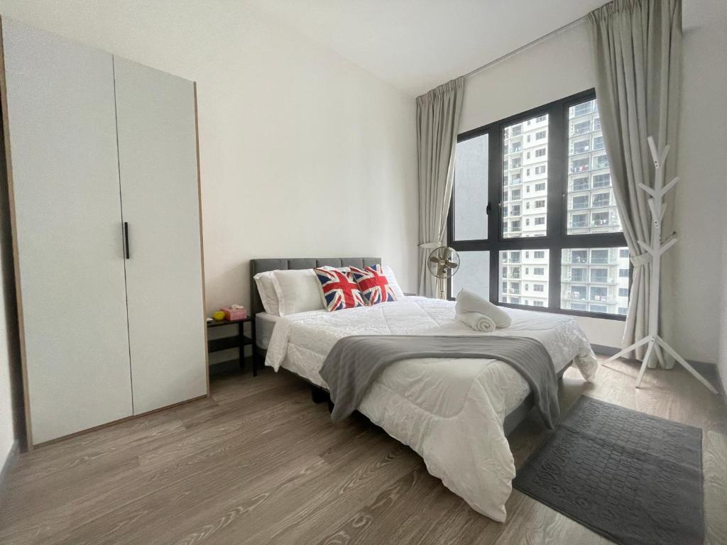 a bedroom with a bed and a large window at Local Living, Global Comfort 4 Pax Bangsar South in Kuala Lumpur