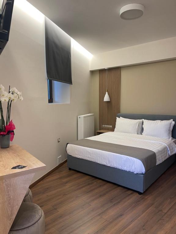 a bedroom with a large bed in a room at 11 Luxury Apartments.. in Metsovo