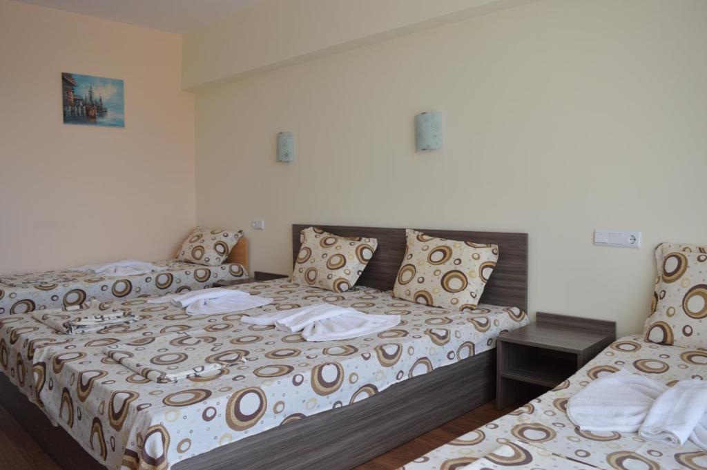 Postel nebo postele na pokoji v ubytování Hotel Ray