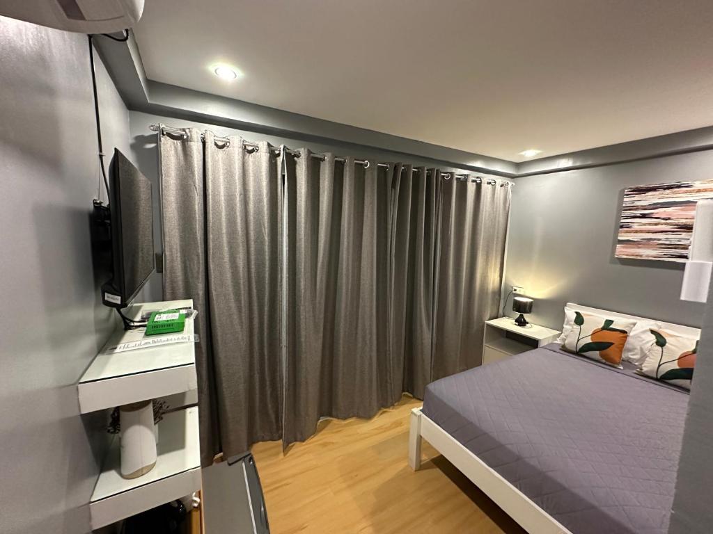 Postel nebo postele na pokoji v ubytování D' Beach Resort