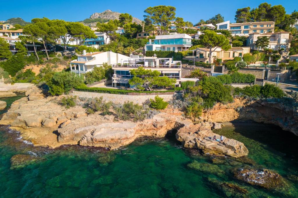 an aerial view of a villa on a rocky coast at Penthouse La Victoria in Cielo de Bonaire 