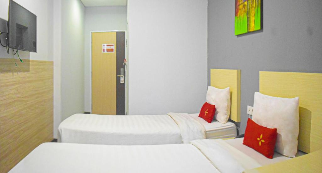 Postel nebo postele na pokoji v ubytování Valore Hotel