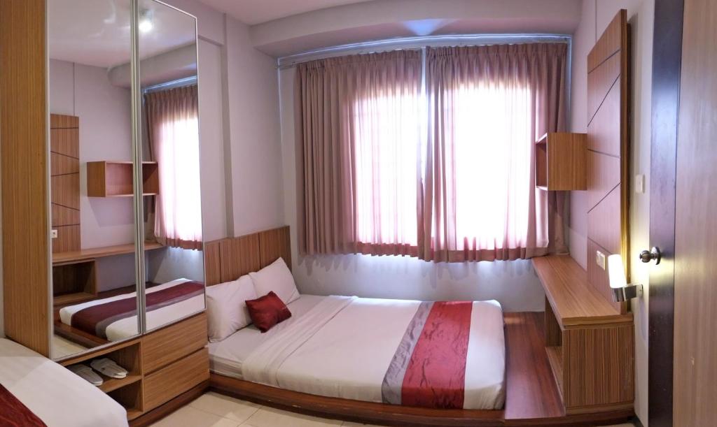 Postel nebo postele na pokoji v ubytování Valore Hotel